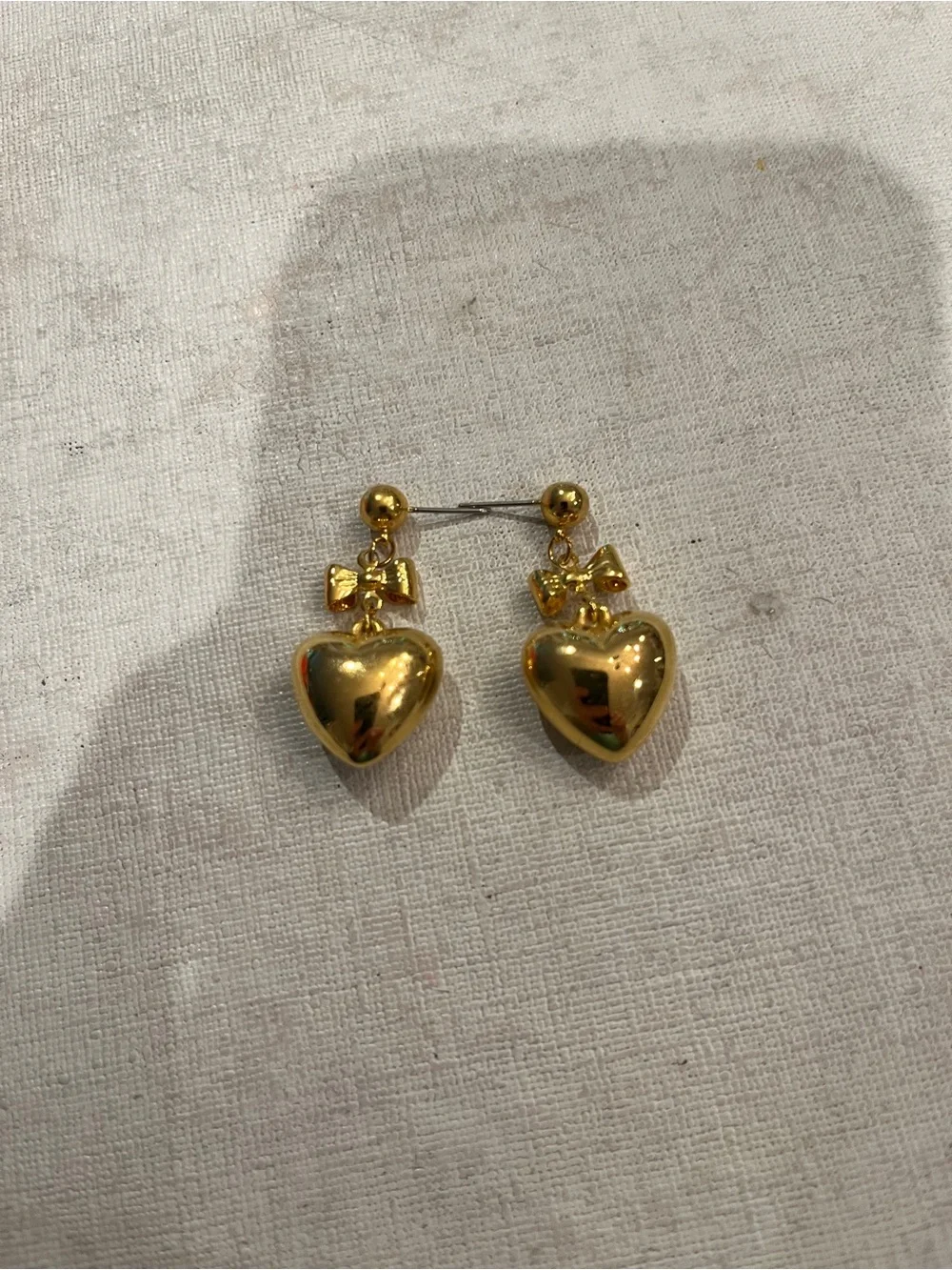 Vintage gold tone bow and puffy heart dangle earrings. So sweet!